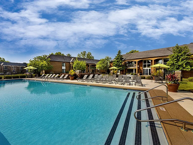 Resort-style pool and expansive sundeck with lounge seating