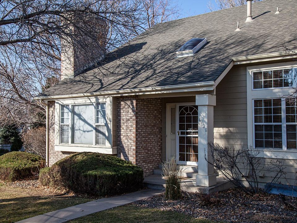 Front entry facing south, showing family room and living room windows.