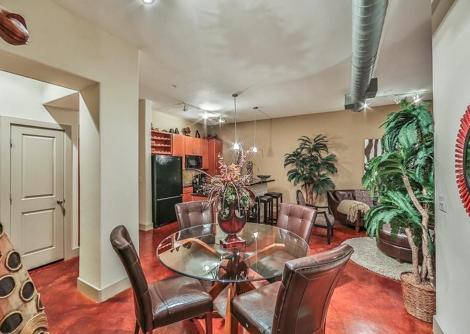 Contemporary dining space seamlessly connected to the kitchen and living room. The open-concept design enhances the sense of space, while modern lighting and finishes make this area ideal for both casual dining and entertaining guests.