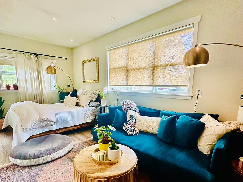 Lots of natural light and dimmable ceiling lighting. Coffee table and couch not included. Queen-sized bed, curtains and privacy shades are included.