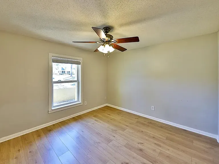 Bedroom with updated paint and new laminate flooring
