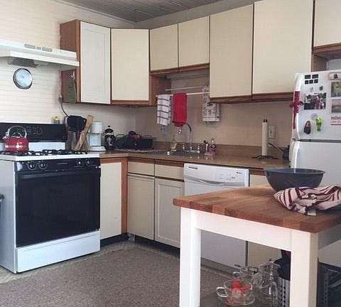 Cute, functional kitchen with dishwasher.