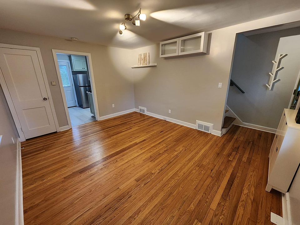 Coat closet, new overhead lighting & showcase cabinetry in living room