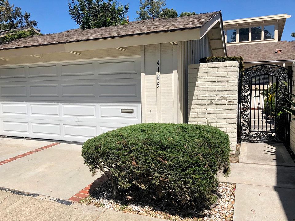 Two car garage with hookups inside for washer and dryer (not included).