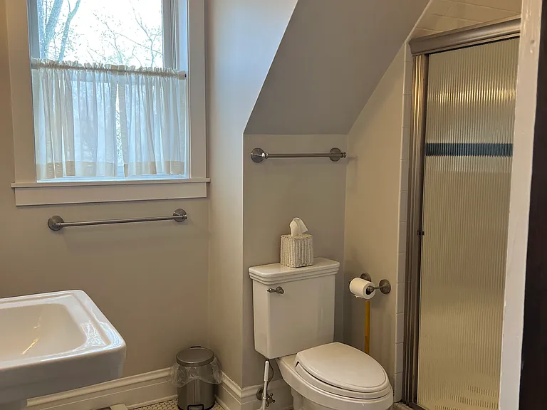 SouthWest corner of apartment there is a bathroom with a large shower. All rooms are bright and sunfilled.