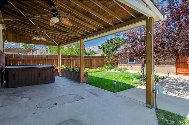 View of the patio unfurnished. Garage is behind the house.
