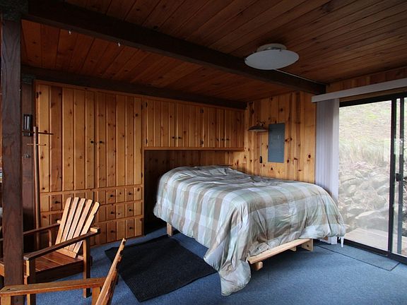 Built in storage surrounds the bedroom area.