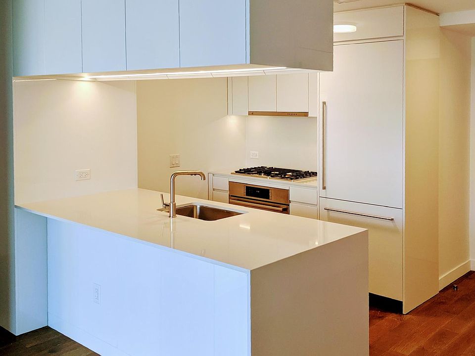 Modern kitchen with Bosch appliances and ample overhead cabinets