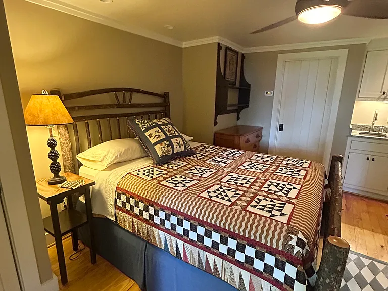 Queen bed with innerspring, pillow top mattress.