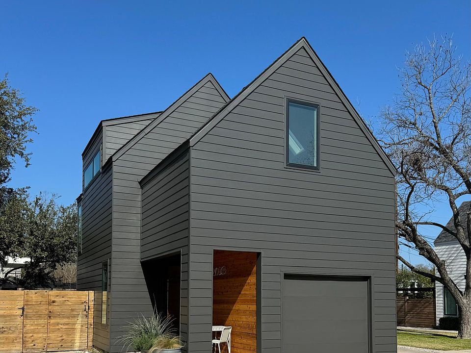 Freshly painted exterior with additional parking next to front porch.