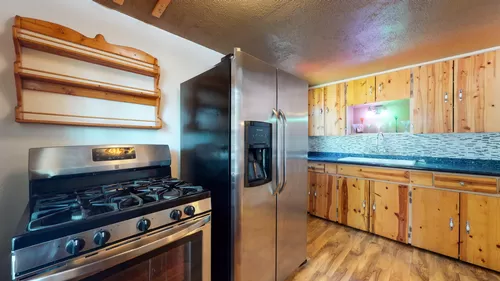 STAINLESS STEEL STOVE AND REFRIGERATOR AND CUSTOM SPICE RACK - 23442 Crest Forest Dr