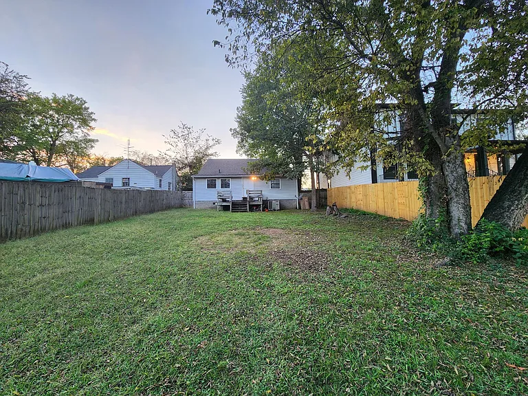 Huge Fenced in backyard. Looking from towards the rear of home.