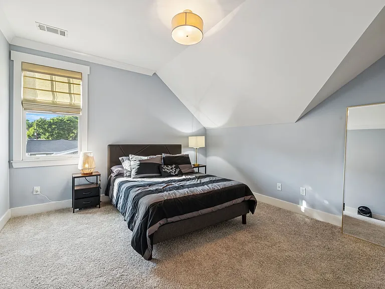 Bedroom 4, featuring a queen bed.