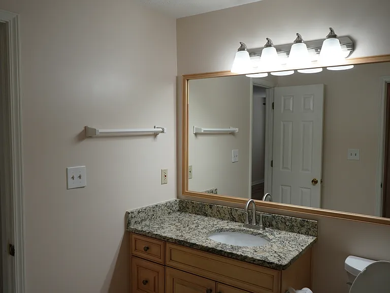 Bathroom Door adjacent to the Main Bedroom