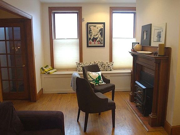 Entrance and living area with woodstove