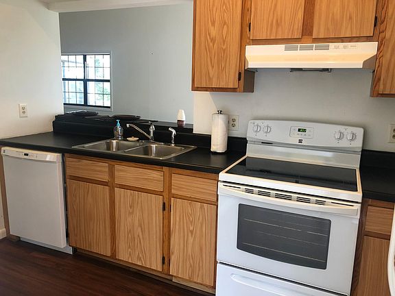 View of kitchen with bar seating.