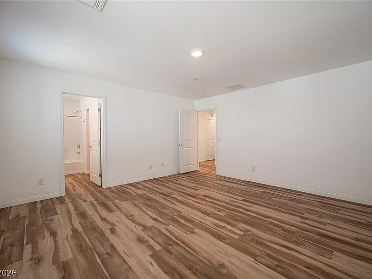 Primary bedroom: "Spacious primary bedroom with bathroom & walk-in closet.