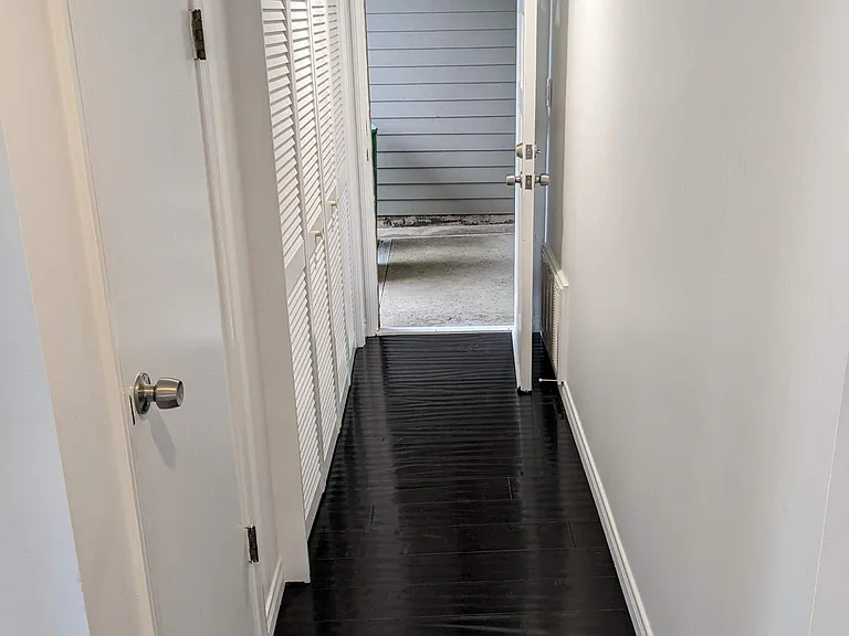 Laundry on left of photo, behind closet. Hallway to carport.