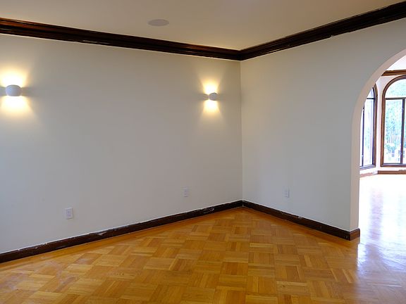From the dining room, the wide arch draws you into the living room