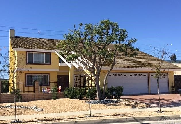 Front View with drought tolerant landscape
