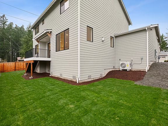 Step down to your private, fully landscaped and fenced backyard