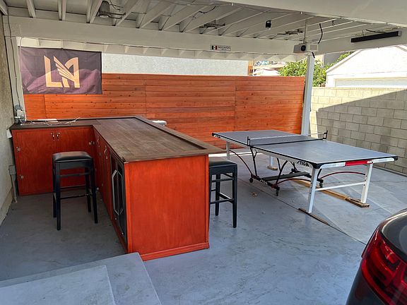 Back yard has custom built bar.