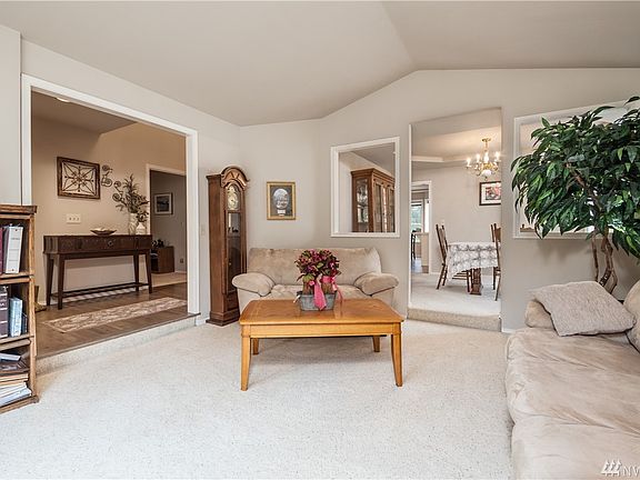 Formal living room has vaulted ceiling