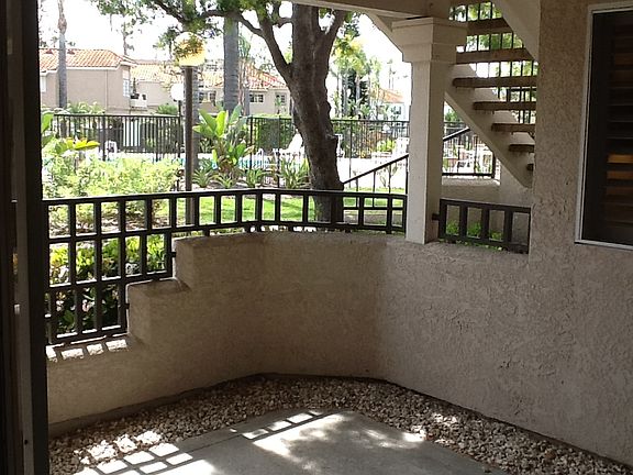 Community pool and jacuzzi across the unit