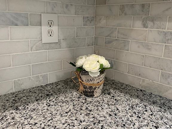 New marble backsplash, granite countertops