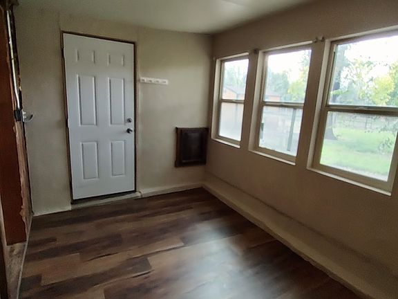 Sun Room just off the front room with separate entry & doggie door
