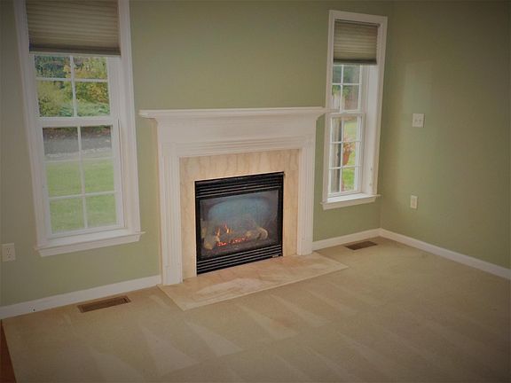 Den off kitchen with gas fireplace