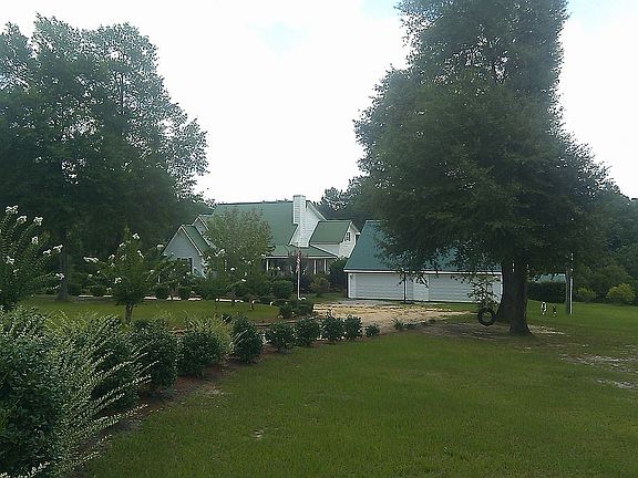 The home and garage from the road...