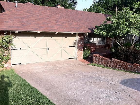Brick walkway to the covered front porch perfect for morning coffee
