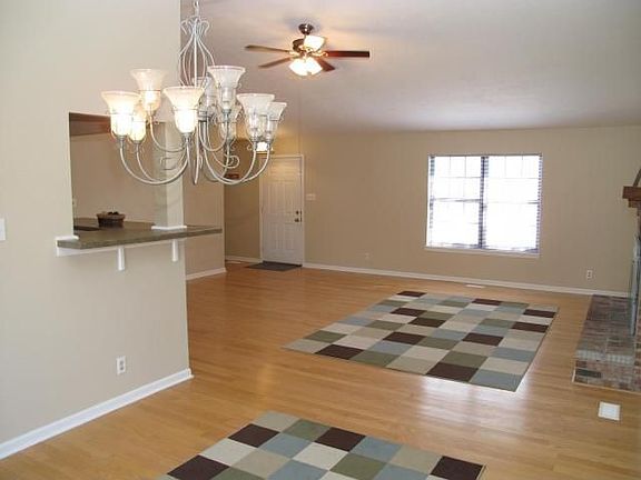 View looking from the Dining Room thru the Great Room toward the Front Entry. 