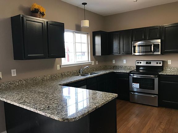 Kitchen with Granite Countertop and Stainless Steel Applianc