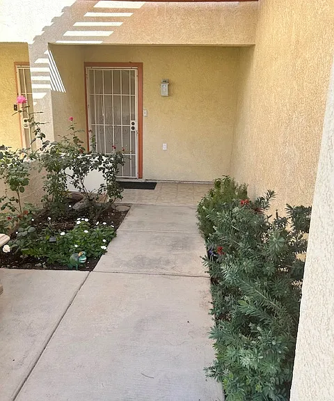 Rose and herb garden with small flowers to main entrance.