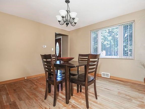 Dining Room: Nicely sized dining room with newer windows, marble window ledges and hardwood floor.