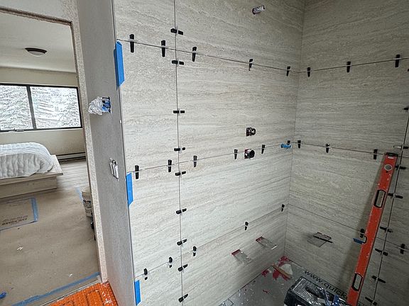 New master walk in shower with luxury tile and fixtures by Waterworks.
Handmade cabinets by LOTUS Cabinetry.