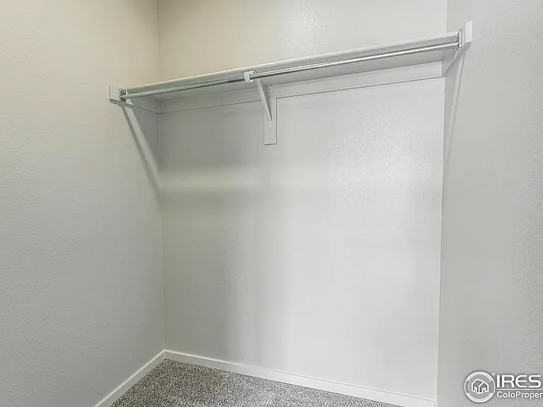 The second guest room walk in closet