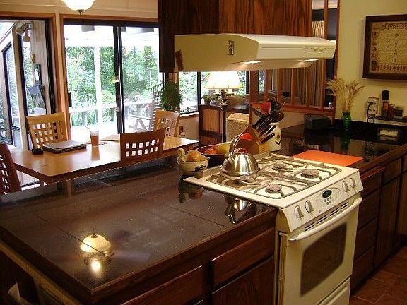 Kitchen w/ dining room in background