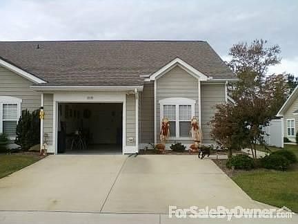 Stree View : Garage, 2 car driveway and the living room bay windows