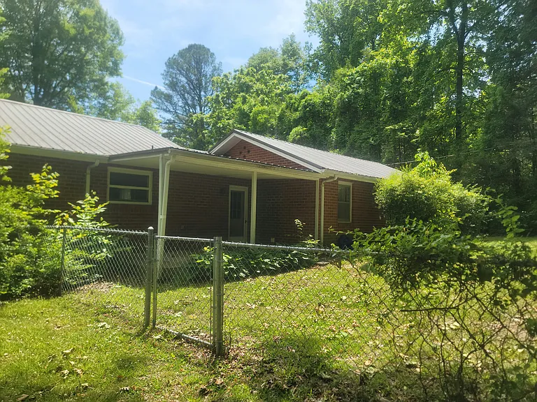 Back of house showing small patio
