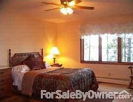 Master Bedroom : Master Bedroom with windows over looking the lake & sliding glass doors to deck.