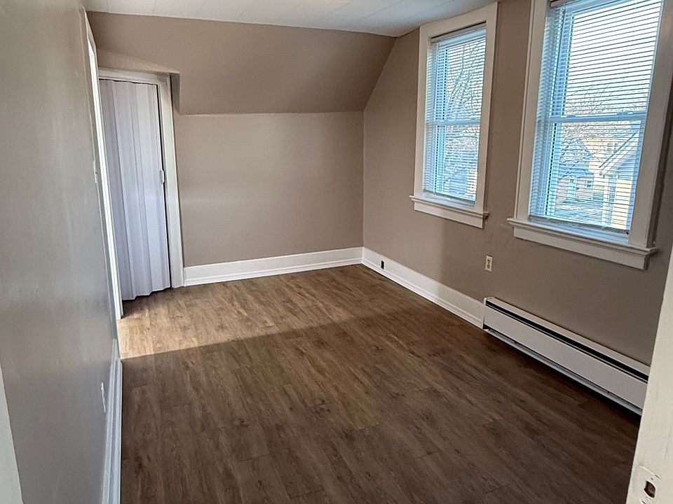 Bedroom #1 enters off the right side of kitchen. This bedroom has fresh paint, new floors, closet, and also the storage closet on opposite side of this picture. Storage area Is in the eve of the house. Two windows give great lighting.