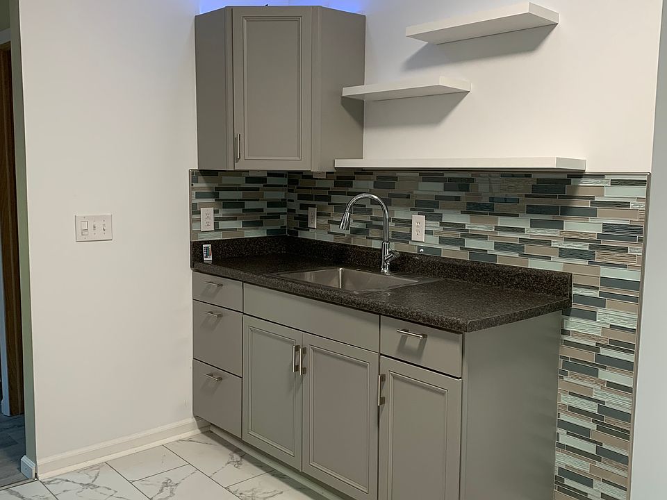 Color changing lights on top of cabinet.
Floating shelves.
Glass backsplash, not peel and stick.