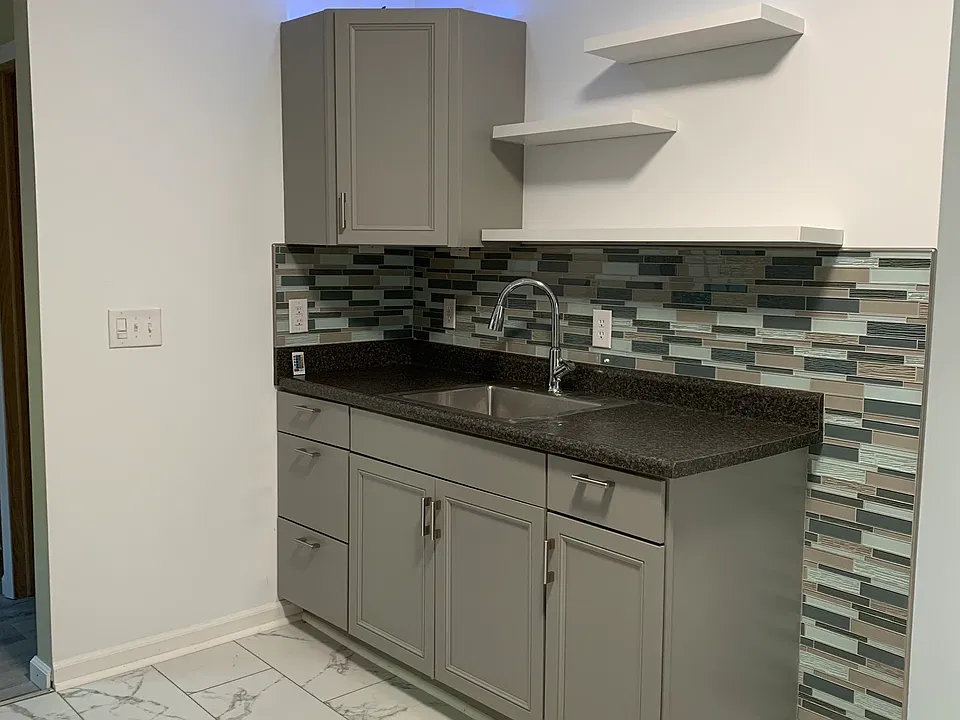 Color changing lights on top of cabinet.
Floating shelves.
Glass backsplash, not peel and stick.