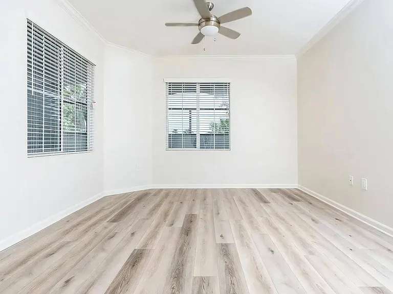 Large Bedroom or Living Space with Ceiling Fan and Natural Light