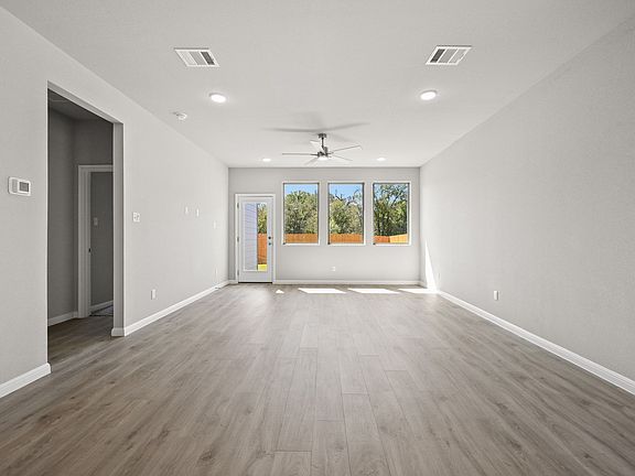 Dining and Living Areas in the Willow home plan by Trophy Signature Homes - REPRESENTATIVE PHOTO