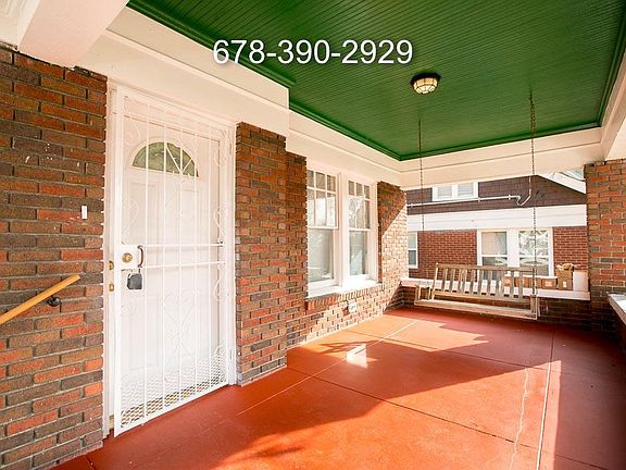 Relax on Sunlit Rocking Chair Porch