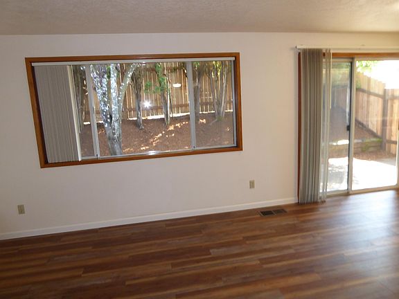 View Into Low Maintenance Gated Private Yard Area With Patio